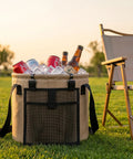 5 Gallon Collapsible Water Bucket With Handle Waterproof PVC Mesh Foldable Outdoor Container filled with ice and drinks on grass