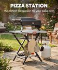 Foldable Outdoor Grill Table And Prep Station With Pizza Oven Base and Griddle Stand for backyard gatherings.