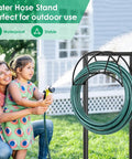 Rugged Garden Hose Holder With Four Spikes And Tool Hooks Built Tough Heavy Duty Hose Reel Stand Holds Up To 160 Foot Hose, shown outdoors with coiled hose.