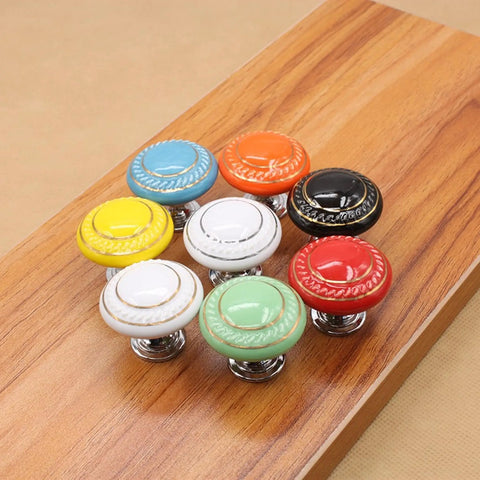 Totally Groovy Blue Mushroom Ceramic Cabinet Knobs, 6 Pack of Glossy Round Drawer Pulls for Dresser and Wardrobe, 1.38 Inch Diameter, Smooth Polish, 3 Screw Sizes Included, Home Makeover Essential multi-colored ceramic knobs on a wooden surface.