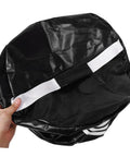Person holding Impact Hitting Bag Golf Swing Trainer Mesh Practice Tool for Enhanced Accuracy with compact design