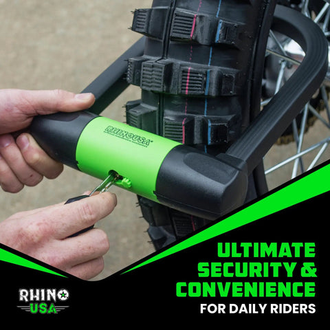 Person securing bike wheel with heavy duty bike lock set including U lock, part of set with 4ft steel cable, padlock, four lighted keys.