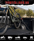 4 Pack Auto-Retractable Ratchet Tie Downs 1 Inch by 12 Foot Cargo Straps securing a bicycle in a truck bed.