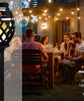 Two-pack waterproof tiki torch Bluetooth speaker near backyard party with flickering LED lights for travel, parties, poolside use