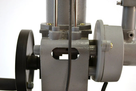 Close-up of Hands On 4 Stroke Diesel Hand Crank Engine Model showing crankshaft and housing detail, 16 inch tall educational tool.