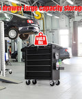 5-Drawer Rolling Tool Chest With Lockable Cabinet And Wheels in a garage workshop, heavy-duty metal tool box organizer, durable black finish.