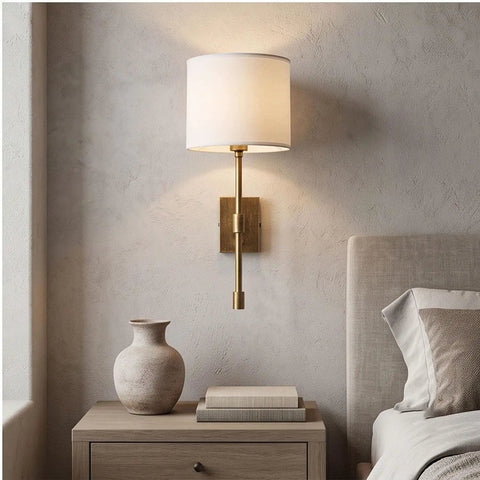 Fabric Shade Wall Sconce Vintage Brass Metal Lamp Bedside Indoor Lighting with white fabric shade and brass arm, mounted on wall.