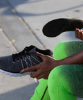 Balance Copper Infused Orthotic Insole being inserted into a shoe for foot and heel pain relief, full length, low profile