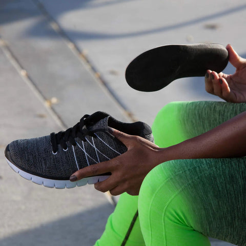 Balance Copper Infused Orthotic Insole being inserted into a shoe for foot and heel pain relief, full length, low profile