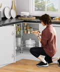 Heavy Duty Steel Corner Organizer With Killer Swivel Action Lazy Susan Turntable And Chrome Pie Cut Design For Kitchen Cabinet Storage Hella Sturdy Build Easy Assembly Top Tier in a corner cabinet with jars and dishes.