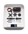 Readytosky 12kg waterproof servo motor kit with metal gears and arm linkages on a digital scale