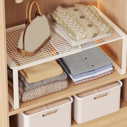 Closet Shelf Organizer Metal Storage Rack for Home Wardrobes with folded linens and handbag, industrial iron frame.