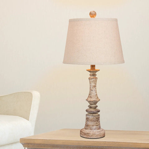 Two Piece Candlestick Resin Table Lamp Set In Cottage Antique Beige With Oatmeal Shade, 26 Inch Tall, on wooden table