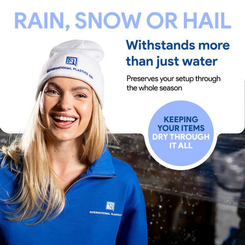 Smiling woman in a blue fleece jacket and white beanie promoting durable protection against rain, snow, and hail.