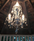 Plug In Crystal Swag Chandelier With Three Lights, White Metal Frame, Clear Glass Stem And Acrylic Crystals hanging in gazebo