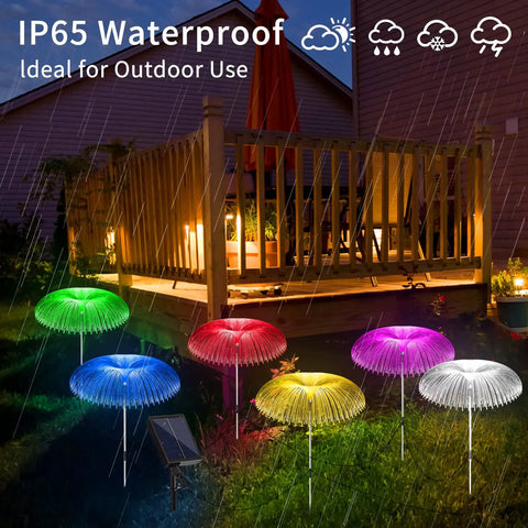 Solar Jellyfish Garden Lights 6 Pack Waterproof Outdoor Pathway Lawn Decor With 7 Color Changing Optical Fiber Bodies glowing in rain.