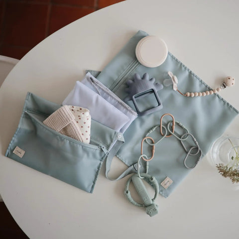 Water Resistant Wet Bags Set Of 2 For Baby Gear And Travel On The Go with accessories on a table