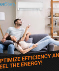 Couple relaxing on couch under wall-mounted air conditioner in modern living room.