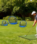 Golfer practicing in backyard with set of 3 golf chipping nets with 12 inch, 18 inch, and 24 inch pop up targets for indoor outdoor practice.