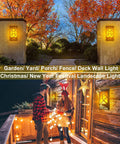6 Pack Solar Flame Lights Outdoor Realistic 3D Flickering Flames Wall Lanterns with 66 Ultra Bright LEDs showcasing holiday decor.