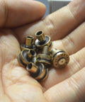 Solid Brass Bullet Rivets With Screw Posts Give Your Leather Accessories A Badass Antique Vibe Perfect For Custom Wallets And Rugged Backpack Repair Projects in hand.