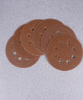 Super Tough 40 Piece 5 Inch Ultra Fine Aluminum Oxide Sanding Discs With Eight Hole Hook Loop Backing, displayed in assorted grit.