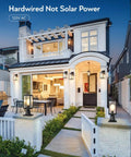 Modern house with Hardwired 120V Dusk To Dawn Outdoor Post Light Black Exterior Lantern, showcasing front garden lighting
