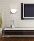 DweLED Mylie 10-In LED Wall Sconce 3000K in Aged Brass With Front Light And Downlight installed in modern living room