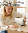 Person using Heavy Duty Packing Tape For Shipping And Moving, Clear, 6 Rolls, 390 Yards Total, 1.88 Inch Wide By 65 Yards Each on box