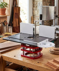 Manual Router Lift Table With Precision Top Plate For 64mm To 66mm Trim Routers Hella Smooth 51mm Vertical Travel on a woodworking bench.