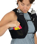 Dyna LT Womens Running Hydration Vest With Hydraulics Soft Flasks in use, showing front pocket storage and flasks, Black Medium