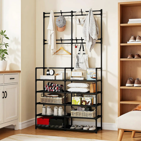 Five Tier Coat And Shoe Rack With Eight Hooks Double Row Organizer For Entryway And Living Spaces Keeps Shoes Hats Bags Neatly Organized In Black For Entryways Closets And Mudrooms Space Saver All In One showing shoes and clothes on rack in a room.