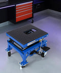 Beefy Hydraulic Motorcycle Scissor Jack Lift With Foot Step Lever And Four Wheels, Height Adjustable, Blue in a garage