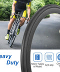 Cyclist using 2 Pack 700x32c Road Bike Tires And Tubes 32-622 700C Foldable Tires with Presta Valve on a winding road