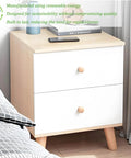 Eco-friendly wooden nightstand with two drawers and books on top beside a bed