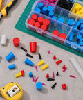 Billion Sky 360 Silicone Rubber Plugs Cover Kit With 9 Sizes From Quarter Inch To Full Inch For Powder Coating Electroplating And Port Protection Plus Heavy Duty Case Keeps Your Workshop Clean And Organized So You Never Hunt. Silicone rubber plugs in organizer case on workshop table