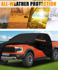 Kistrba cab car cover for mid-size crew-cab pickup, full-body black cover shown on an orange pickup.