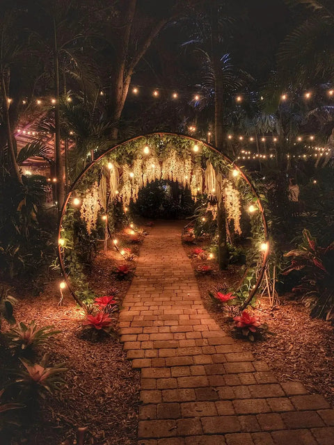 Romantic garden path with hanging lights, showcasing remote dimmer switch for outdoor string lights with 300W timing and dimming.