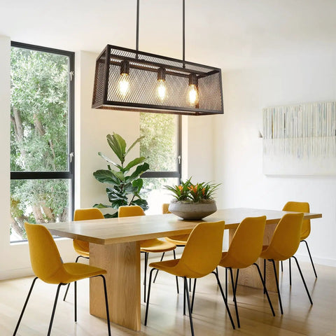 Dining room with Dope 4 Light Industrial Chandelier with Metal Shades, black finish, over wooden table and yellow chairs.