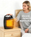 Woman using Compact Ceramic Desk Heater Space Saver With Thermostat 1500W 750W Dual Power Settings Fast Heating Quiet Under Desk Space Heater