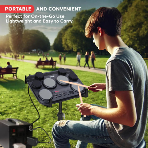 Person using Compact Tabletop Electronic Drum Pad Kit With 8 Touch Sensitive Pads And Pedals, 600 Sounds outdoors