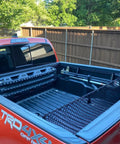 Image of Two Pack High Lift Jack Mount Brackets For Truck Bed Deck Rail System Compatible With Toyota Tacoma 2005 Plus installed in truck bed