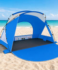 Portable Beach Sun Shelter For 2 To 8 People, UPF 50 Plus UV Protection, blue shade canopy on sandy beach with ocean view
