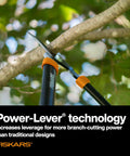 Go-To 28-Inch Power-Lever Bypass Lopper trimming tree branch, highlighting Power-Lever technology for enhanced cutting strength.