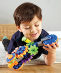 Child playing with Cycle STEM Kit For Hands On Learning And Fine Motor Skills, 30 Piece Toddler Explorer Set with colorful gear bits.