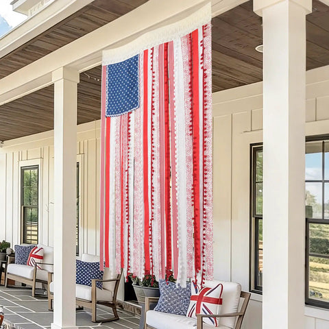 Vintage American Flag Rag Ribbon Banner For Fourth Of July Decor hanging on porch, rustic 4x2.3 ft size, patriotic outdoor display.
