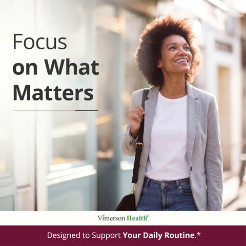Smiling woman in casual attire walking outdoors, promoting Women’s Daily Multivitamin For Energy, Focus, And Immunity With CoQ10 And Panax Ginseng, Premium Multimineral Formula For Busy Moms And Driven Women, 60 Liquid Capsules.