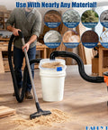 Low-Profile Cyclone Dust Separator with 2-1/2 Inch Hose high-flow dust collector attached to shop vacuum in workshop.