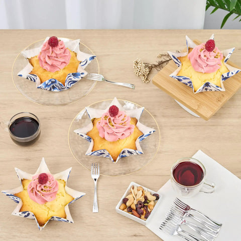 Decorative cupcakes in Bulk 4000 Pack Greaseproof Cupcake Liners 10.2 Ounce Disposable Oven Safe Bake Cups on table