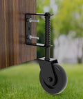 Heavy Duty Gate Wheel With Smooth Spinning Rubber Casters And Auto Adjusting Spring Mount for wood fence setup on grass.